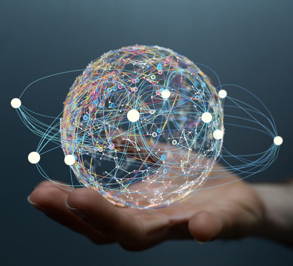 Image of a hand holding a digital glove representing worldwide collaboration for Accreditation Management
